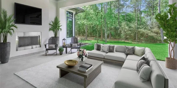 Natural light filling a living room through floor to ceiling glass doors
